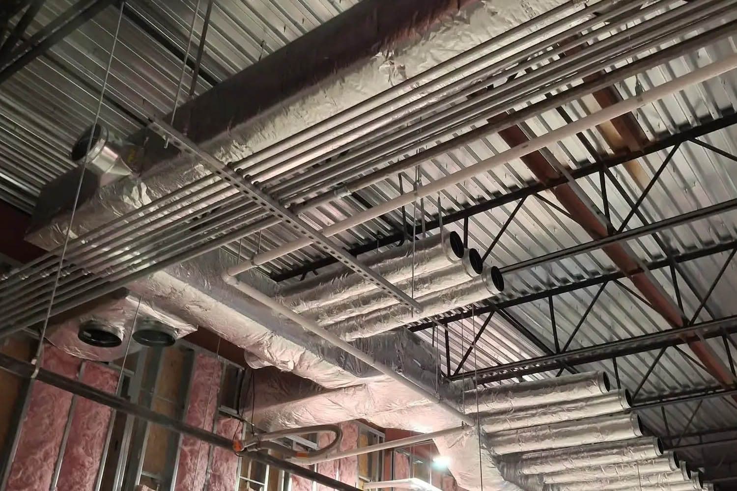 Exposed spiral duct in a finished commercial space